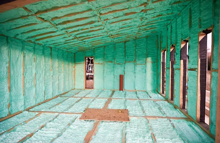 Spray foam insulation installed in a building assembly